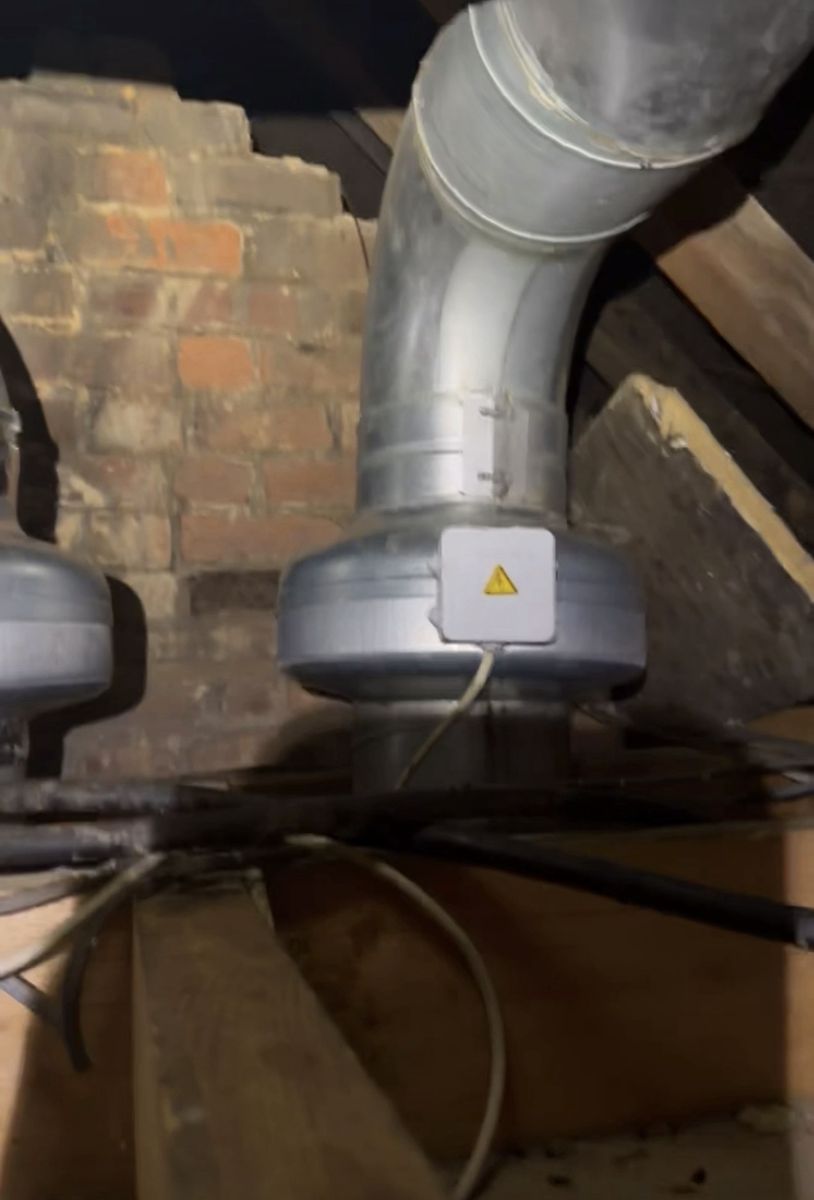 New inline extraction fans fitted on kitchen ductwork in a loft