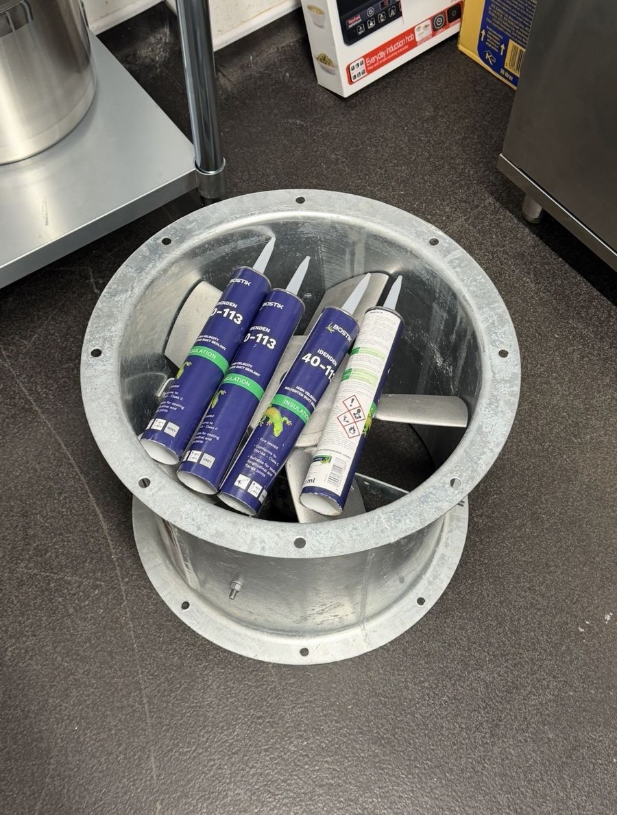 New cased extraction fan on a kitchen floor ready to be fitted
